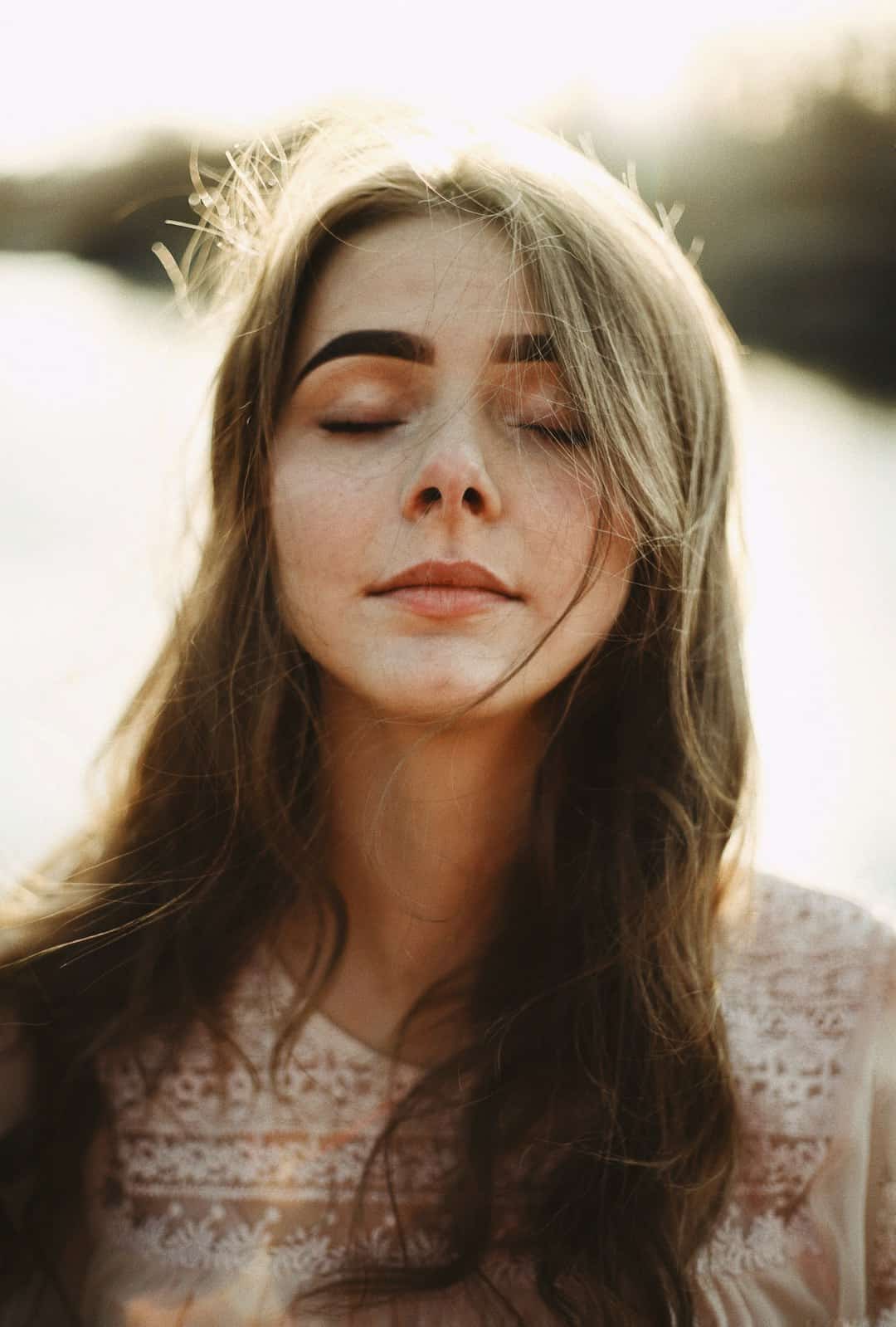 Photo by ilya mondryk woman in white floral lace shirt